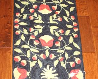 Lovely hooked rug.