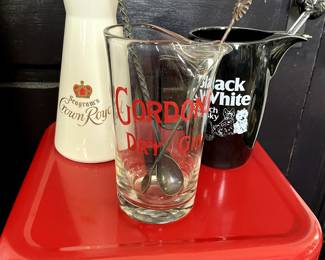 Vintage Gordan's Dry Gin Pitcher w/ Sun Spoon $125, Vintage Ceramic Crown Royal Pitcher w/ Spoon $45, Vintage Black and Whit Water Pitcher w/ Spoon $50.
