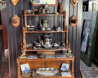 Three Tier Silver Display 19th Century, Price $225. Antique Ireland Cahersiveen (Drink Trolley) on ceramic wheels 19th Century. Price $575. Antique Dutch Hand-colored Etching $395. Pair Deer Hooves $225. Pair of Goat Hooves $325.