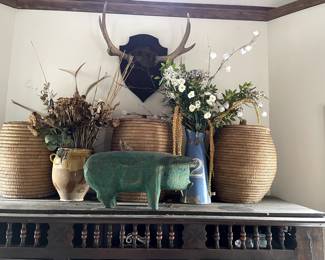 Top of cabinet: Moose Antler Mount $295, 3 African Reed Storage Baskets $375, Blue Tin Pitcher w/ Flowers $165, Vintage Carved Mexican Wooden Pig $295. Antique French Provincial Pot de Tien $547.