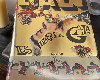 Salvador Dali Large Lithograph from Les Diners de Gala Series. numbered in pencil, 297/395. Pencil signed with pen and ink drawings. Along with Hardbound Cookbook with the same name. Price $6795