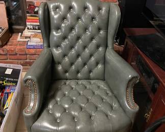 Leather armchair with studs