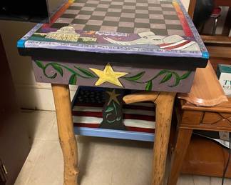 Painted wooden end table with checkerboard and branch legs