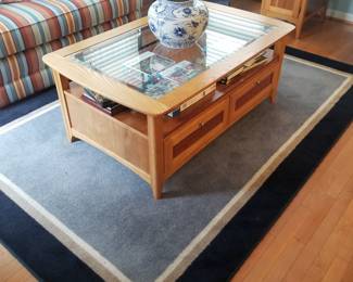 Area rug; glass top coffee table