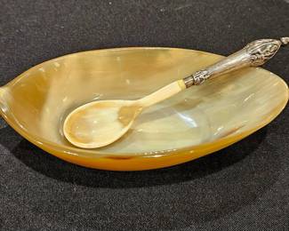 Horn bowl and spoon with sterling handle. For    caviar or sauce