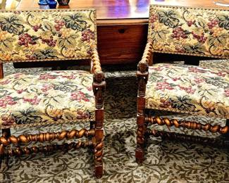 Floral embroidered chairs with incredible carved wood arms and legs with female faced hand rests