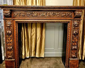 19th Century ornate hand carved walnut Fireplace Mantle with Lions head and foliage detail. Absolutely stunning.