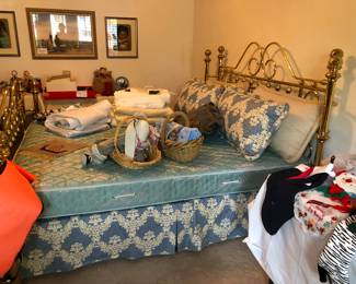 The brass bed and miscellaneous bedding, holiday and decor