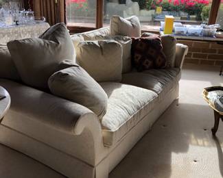 Creamy colored sofa there are two