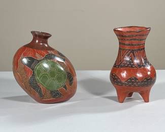 (2PC) CENTRAL / SOUTH AMERICAN POTTERY VESSELS | Including small round vase on tripod feet and colorfully carved turtle vase signed “Celia Salezar” on bottom. -  h. 7 x dia. 6 in (larger)

