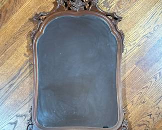 CARVED WALL MIRROR | Rounded carved mirror with floral relief on top. - l. 29 x h. 46.25 in

