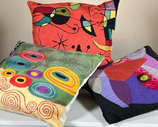 (3PC) MANNER OF JOAN MIRO ARTSY STITCHED PILLOWS | Two in the style of Miro and one with patchwork patterns. -  l. 16 x w. 16 in (two larger)

