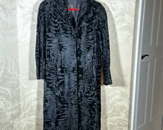 PERSIAN ASTRAKHAN LAMBSKIN COAT | The interior with silk lining with Chinese shou characters, no apparent tags, heavy and supple feeling. - w. 19 x h. 48 in (at shoulders approx)
