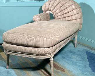 SCROLL UPHOLSTERED CHAISE LOUNGE | Tan lounger with curved scroll work upholstered back. -  l. 62 x w. 29 x h. 34 in

