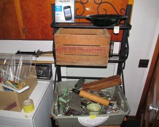 antique green and red handled kitchen ware