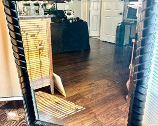 Large black framed mirror