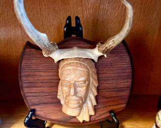 Head on plaque with antlers