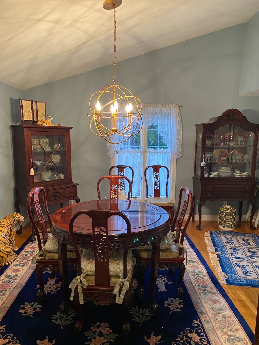 Asian inspired dining table with 8 chairs and 2 leaves