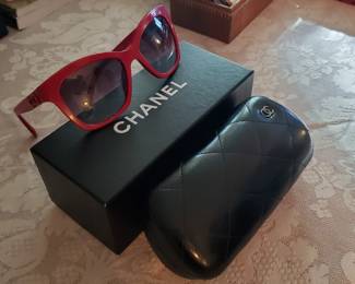 Pair of Chanel Sunglasses in red. New in box with case. Never worn. 