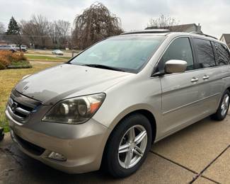 2006 Honda Odyssey minivan with 180k miles. Well maintained, handicapped scooter lift comes with it that attaches in back, leather, heated seats, power doors & rear hatch, stow and go seating, third row seating, rear entertainment, and much more