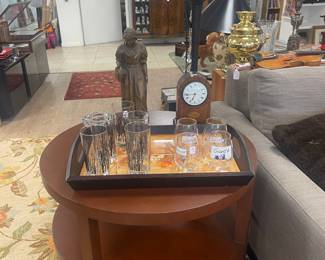 PAIR of round tables with shelves