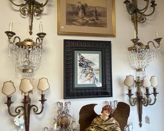 Multiple pairs of sconces.