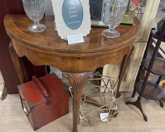 Demi lune/round game table. Cabriole legs  Mahogany with cross banding