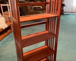 Folding shelves 50 inches tall, 22 1/2 inches wide and 11 1/2 inches deep