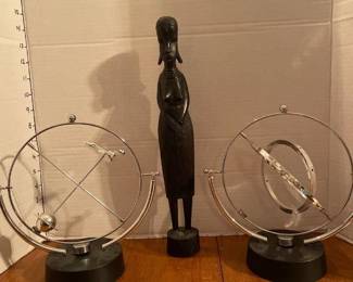 Ceramic figurine and two perpetual motion home decor pieces