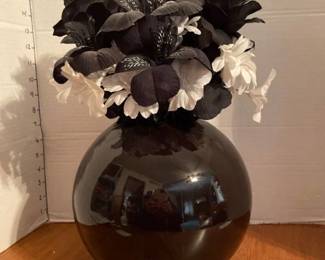 Black glass vase with faux flowers