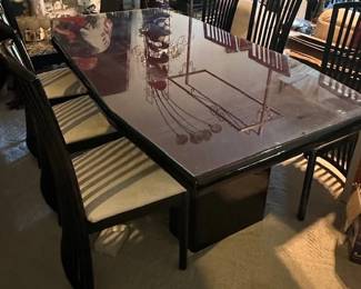 Elegant dinning table with 6 chairs. In excellent condition. $900
