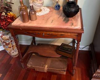 Pink marble-topped spindle leg table