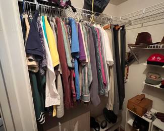 Man's closet - lots of clothes