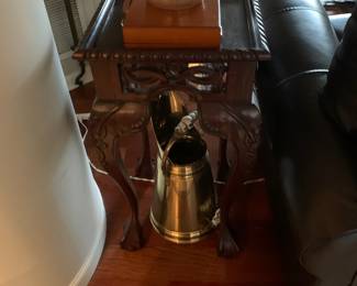 Side table; brass pitcher; stoneware crock