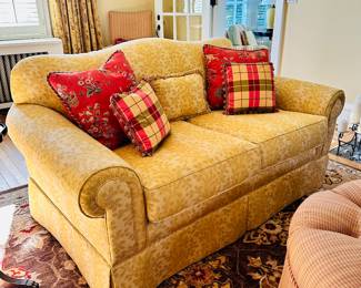 Custom rolled arm two-seat camel back love seat.