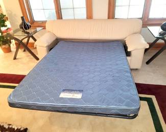 White leather sleeper sofa...