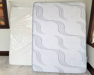Queen mattress (front), King Temperpedic mattress (behind)