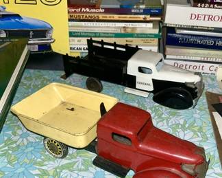 Red/yellow antique metal truck, vintage & modern collectible car books