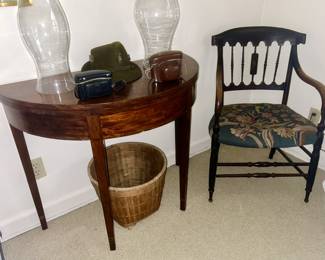 Close-up view of half moon (sold), glass hurricane globes, antique wooden chair with stitched seat, vintage cameras (sold), etc.