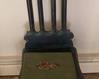 Very unusual chair with a storage area under the pad.