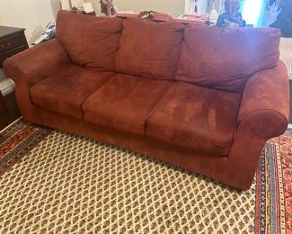 Rust colored suede sofa and loveseat