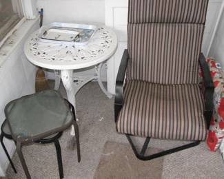 White table is plastic, nice metal frame swivel rocker