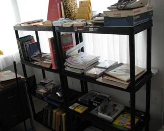 Office items, books, LP records, it is hard to see but there is a vintage Apple Think Pad Laptop, adding machines and more