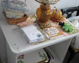 another lamp, on the bottom is a stack of placemats for every occasion