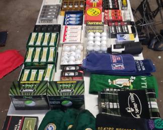 New golf balls in boxes