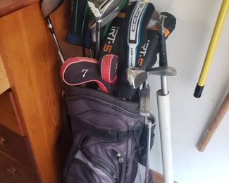 Lot of golf clubs.. still going thru garage