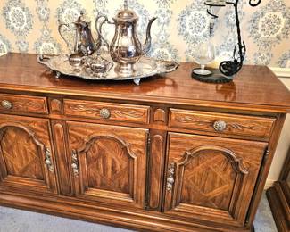 Console with lots of storage and a beautiful serving tray with pieces on top