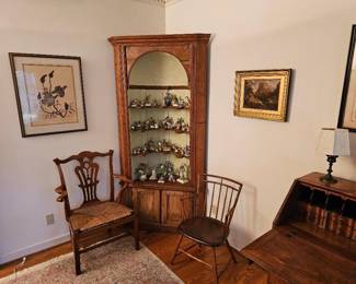 Antique domed corner cupboard, collection of bird figurines, Rush seat chair, one of a pair of Windsor chairs