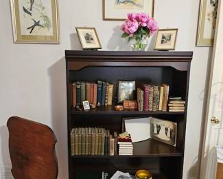 Antique books, bookcase, tilt top table
