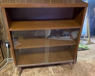 Pair of these mid century shelves with sliding glass doors.
